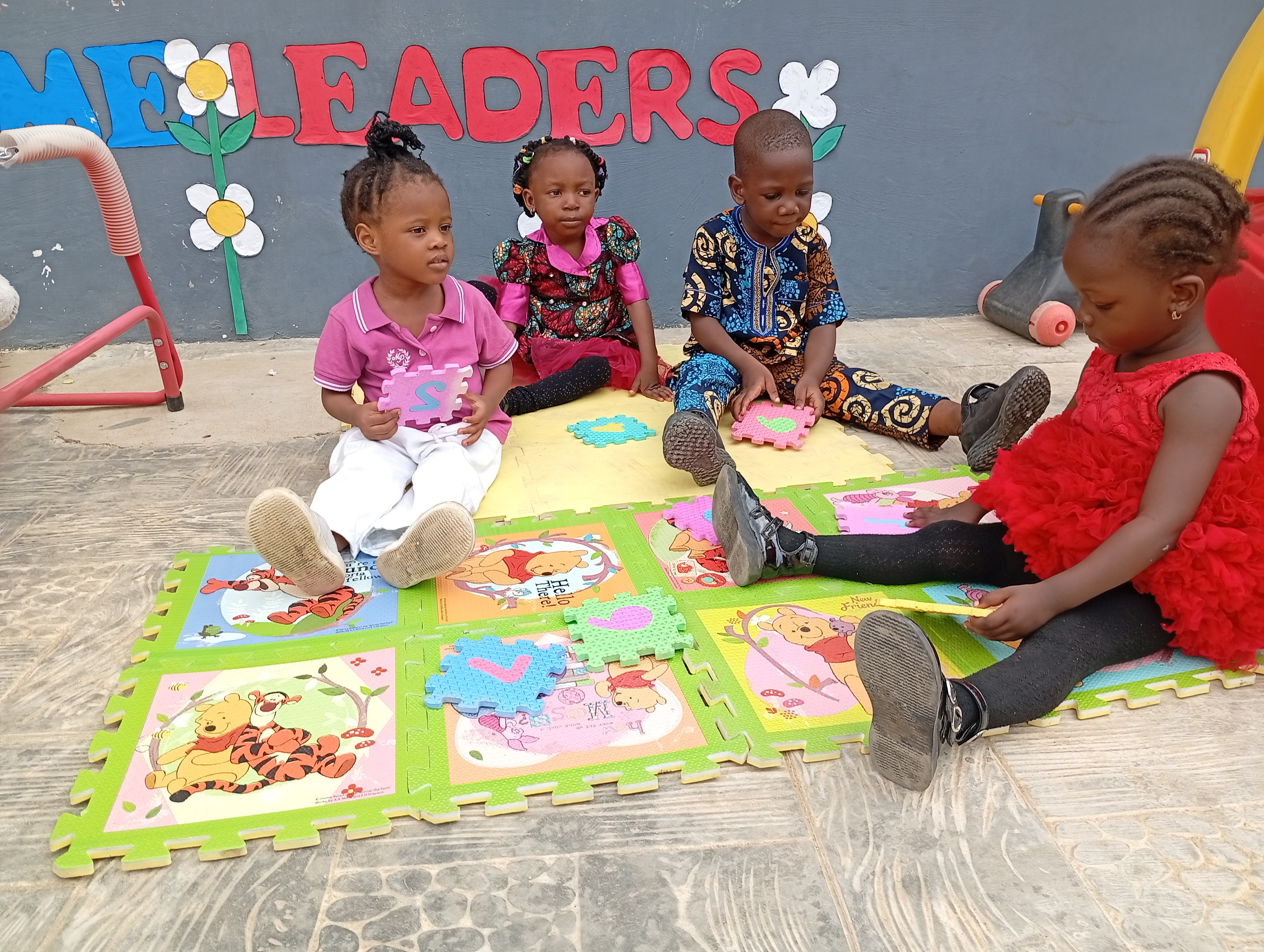 Nursery pupils learning with colorful play mats